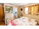 Cozy bedroom featuring a floral-themed bedspread and view into an ensuite bathroom at 1512 W Sitka St, Tampa, FL 33604