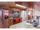 Functional kitchen with stainless steel appliances, granite counters, tile flooring, and plenty of storage at 1512 W Sitka St, Tampa, FL 33604