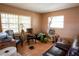 Cozy living room featuring tile floors, natural light, and comfortable seating at 1512 W Sitka St, Tampa, FL 33604