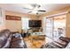 Comfortable living room with tile floor, ceiling fan and sliding doors to the patio at 1512 W Sitka St, Tampa, FL 33604