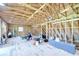 Spacious unfinished attic with exposed beams, awaiting customization at 16930 Sweetwater Rd, Dade City, FL 33523
