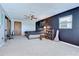 Bedroom with dark accent wall and fan at 16930 Sweetwater Rd, Dade City, FL 33523