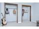 Bedroom walk-in closets with wood trim and guitars at 16930 Sweetwater Rd, Dade City, FL 33523