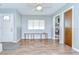 A bright entryway featuring wood floors, a bench, and a closet for storage at 16930 Sweetwater Rd, Dade City, FL 33523