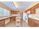 A kitchen featuring a large window, an island, and plenty of counter space at 16930 Sweetwater Rd, Dade City, FL 33523