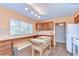 A bright kitchen featuring wood floors, an island, and plenty of natural light at 16930 Sweetwater Rd, Dade City, FL 33523