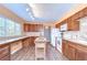 A kitchen featuring a large window, an island, and plenty of counter space at 16930 Sweetwater Rd, Dade City, FL 33523