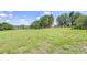 Expansive green property with lush grass, trees, and beautiful views, the perfect spot to build your dream home at 16930 Sweetwater Rd, Dade City, FL 33523