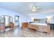 Spacious main bedroom features hardwood floors and ensuite bath at 16930 Sweetwater Rd, Dade City, FL 33523