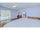 Spacious main bedroom featuring sliding glass doors to deck at 16930 Sweetwater Rd, Dade City, FL 33523