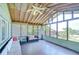 Sunroom features large windows and comfortable seating at 16930 Sweetwater Rd, Dade City, FL 33523
