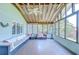 Sunroom features large windows and comfortable seating at 16930 Sweetwater Rd, Dade City, FL 33523