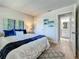 Inviting bedroom with a plush bed, stylish decor, and an attached bathroom at 1701 Pinehurst Rd # 16C, Dunedin, FL 34698