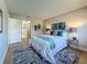 Comfortable bedroom with stylish decor, soft bedding, and ample natural light at 1701 Pinehurst Rd # 16C, Dunedin, FL 34698