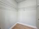 Walk-in closet with ample storage space, and a clean, organized shelving system at 1701 Pinehurst Rd # 16C, Dunedin, FL 34698