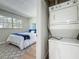 Bedroom laundry with modern washer and dryer, showcasing convenience and functionality at 1701 Pinehurst Rd # 16C, Dunedin, FL 34698