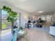 Open-concept living room with natural light, wood floors, and cozy decor at 1701 Pinehurst Rd # 16C, Dunedin, FL 34698