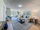 Inviting living room with wood floors, neutral paint, plenty of natural light, and modern decor at 1701 Pinehurst Rd # 16C, Dunedin, FL 34698
