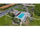 Aerial view of a community pool and surrounding landscaping at 1701 Pinehurst Rd # 16C, Dunedin, FL 34698