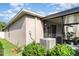 The back of the home featuring the lanai with a view to the backyard at 17334 White Mangrove Dr, Wimauma, FL 33598