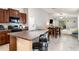 Open-concept kitchen flows into dining area and living room, perfect for entertaining guests at 17334 White Mangrove Dr, Wimauma, FL 33598