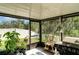 Enclosed lanai, perfect for enjoying the Florida weather, offers outdoor lounging and dining at 17334 White Mangrove Dr, Wimauma, FL 33598