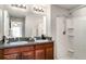 Double vanity and walk in shower create an elegant feel in the main bathroom at 17334 White Mangrove Dr, Wimauma, FL 33598