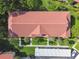 Overhead view of roof with lush landscaping, covered parking, and sidewalks at 1801 E Lake Rd # 3A, Palm Harbor, FL 34685