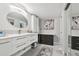 Modern bathroom with double vanity, decorative art, and great lighting at 1801 E Lake Rd # 3A, Palm Harbor, FL 34685