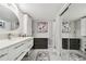 Modern bathroom with double vanity, decorative art, and great lighting at 1801 E Lake Rd # 3A, Palm Harbor, FL 34685