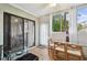 Sunroom features a glass table and large windows providing great natural light at 1801 E Lake Rd # 3A, Palm Harbor, FL 34685