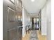 Inviting condo entrance boasts tile flooring and glimpses into the living spaces beyond the open door at 1801 E Lake Rd # 3A, Palm Harbor, FL 34685