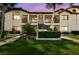 Condo complex showcasing a two-story building with well-maintained landscaping and inviting front entrances at 1801 E Lake Rd # 3A, Palm Harbor, FL 34685