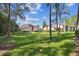 Charming condos boast lush lawn, mature trees, and a serene setting at 1801 E Lake Rd # 3A, Palm Harbor, FL 34685