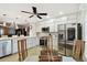 Bright kitchen boasts stainless steel appliances, white cabinets, and a view into the dining area at 1801 E Lake Rd # 3A, Palm Harbor, FL 34685