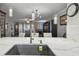 Modern kitchen showcasing stone countertops, stainless steel appliances, and an open view to the living space at 1801 E Lake Rd # 3A, Palm Harbor, FL 34685