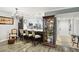 Modern kitchen with a breakfast bar, sleek counter tops, and stainless steel appliances with glossy wood floors at 1801 E Lake Rd # 3A, Palm Harbor, FL 34685