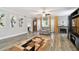 Inviting living room featuring a fireplace, a comfortable chair, and stylish decor for relaxing ambiance at 1801 E Lake Rd # 3A, Palm Harbor, FL 34685