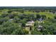 Home nestled amongst the trees, an aerial view that highlights a tranquil, green landscape at 2015 Pleasant Acre Dr, Plant City, FL 33566