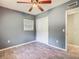 Comfortable bedroom with ceiling fan, closet, and wood-look tile flooring at 2015 Pleasant Acre Dr, Plant City, FL 33566