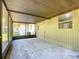 Open screened porch showing backyard access and side of home at 2015 Pleasant Acre Dr, Plant City, FL 33566