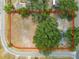 An aerial view of an expansive homesite surrounded by lush greenery, with the property boundaries clearly defined at 2504 Jim Johnson Rd, Plant City, FL 33566