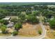 An aerial view of an expansive homesite surrounded by lush greenery, with the property boundaries clearly defined at 2504 Jim Johnson Rd, Plant City, FL 33566