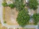 An aerial view of an expansive homesite surrounded by lush greenery, with the property boundaries clearly defined at 2504 Jim Johnson Rd, Plant City, FL 33566