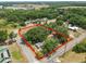 Expansive aerial view of a treed homesite with property lines, showcasing the lot's dimensions and lush surroundings at 2504 Jim Johnson Rd, Plant City, FL 33566