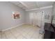 A bedroom featuring a tiled floor and two windows, ready for renovation and improvements at 2504 Jim Johnson Rd, Plant City, FL 33566