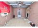 Bedroom featuring tile flooring, access to the backyard, and an air conditioning unit at 2504 Jim Johnson Rd, Plant City, FL 33566