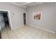 A bedroom featuring a tiled floor and two windows, ready for renovation and improvements at 2504 Jim Johnson Rd, Plant City, FL 33566