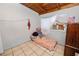 A bedroom featuring a small mattress on the floor, wood ceiling, and window air conditioner at 2504 Jim Johnson Rd, Plant City, FL 33566