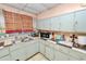 A kitchen featuring vintage cabinets and countertops, ready for renovation and improvements at 2504 Jim Johnson Rd, Plant City, FL 33566